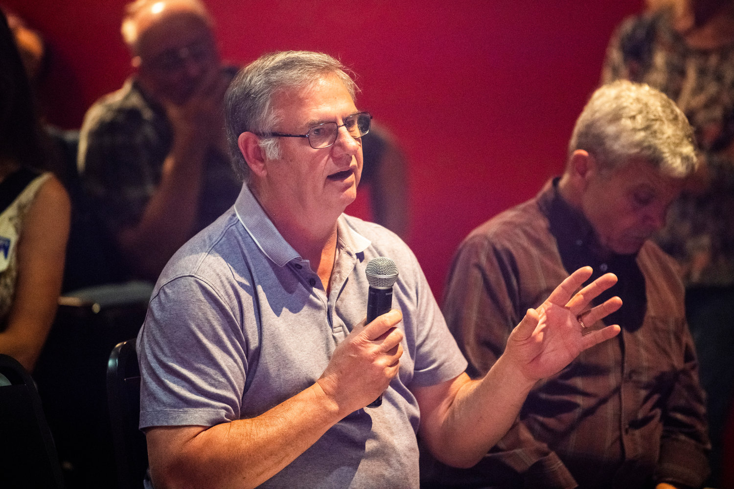 Mossyrock Mayor Randall Sasser asks questions to candidates at the Roxy Theater Tuesday in Morton.