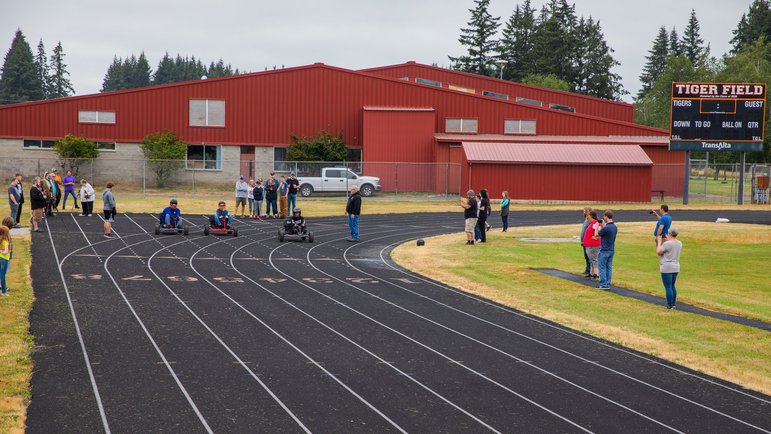 Drivers speed off from the start line around the Napavine High School track on Thursday.