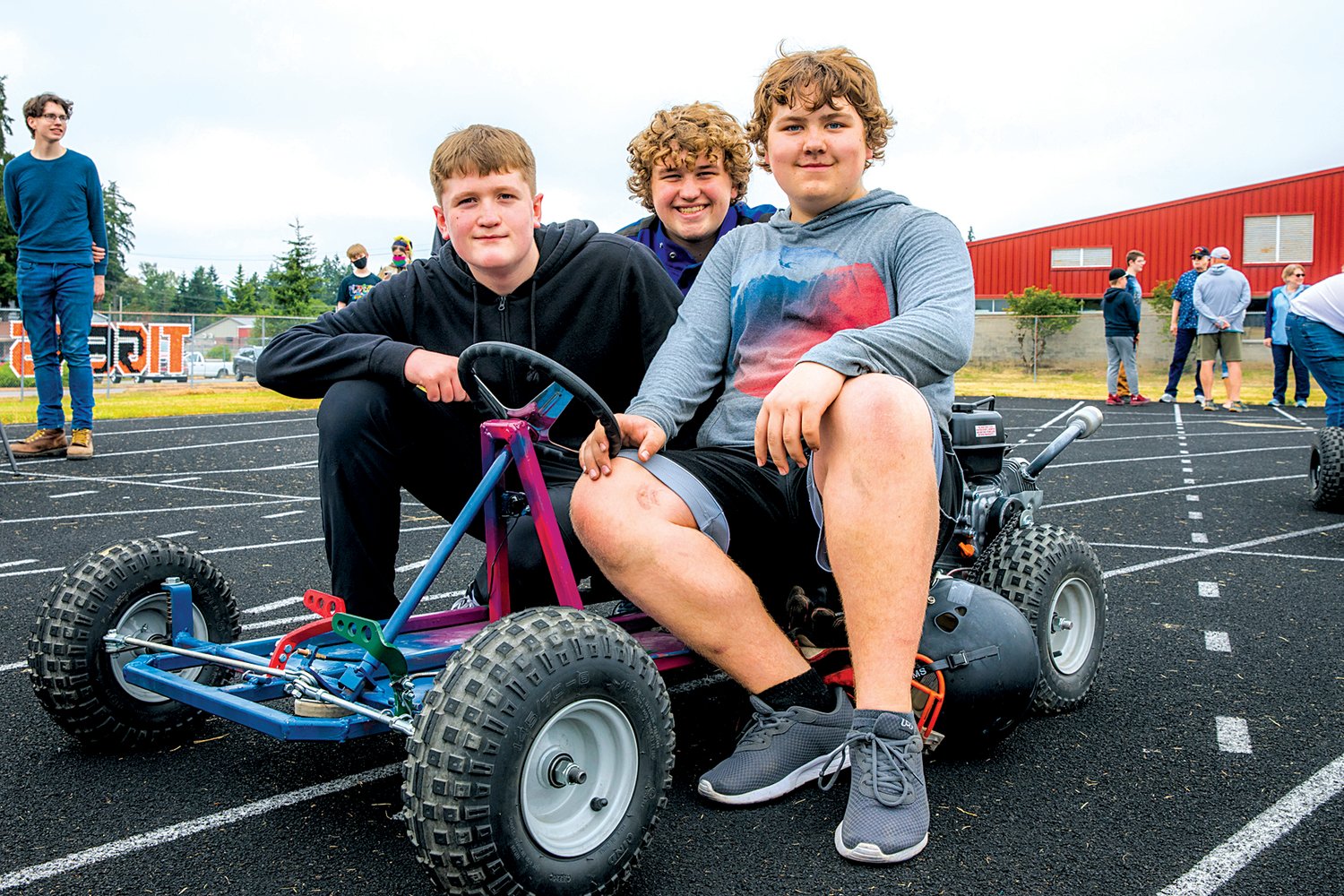 From left Maguire Finn, Lakota South and Nolan Gaskill pose for a photo with their go-kart on the Napavine High School track Thursday morning.