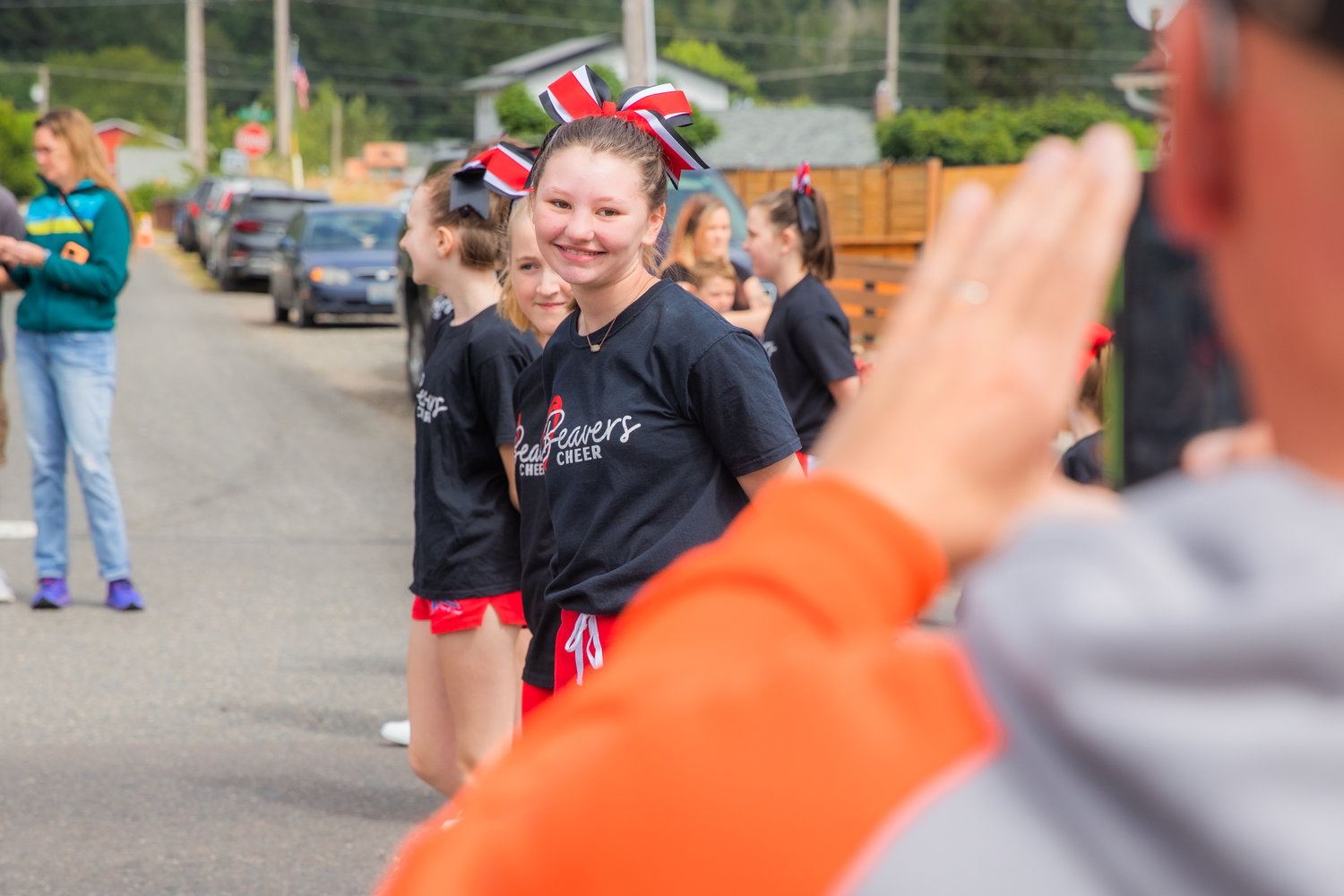 Cheerleaders smile for photos during the Oregon Trail Days parade Saturday morning.