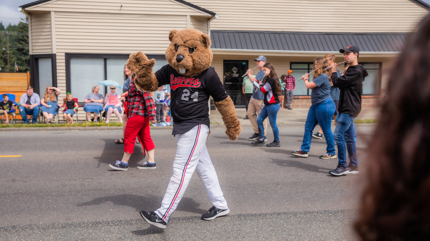 The Beavers mascot waves while walking in the Oregon Trail Days parade Saturday morning in Tenino.