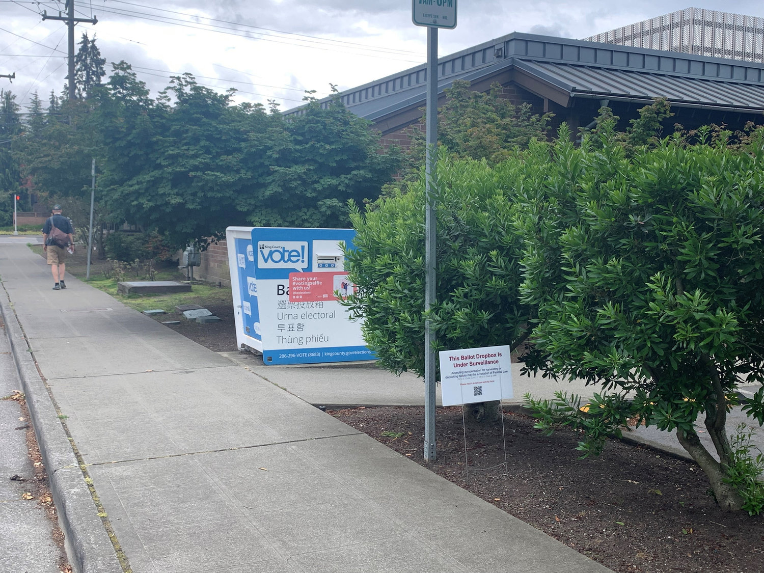 A sign posted outside the Seattle Public Library’s Broadview Branch on Sunday, July 17, 2022, warns that a ballot box there is "under surveillance." (Jim Brunner/The Seattle Times/TNS)