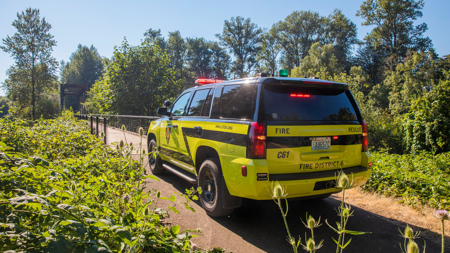 A Fire District 6 vehicle is seen parked at the Chehalis River Friday afternoon at the trestle along the Willapa Hills Trail off Highway 603 following a drowning.