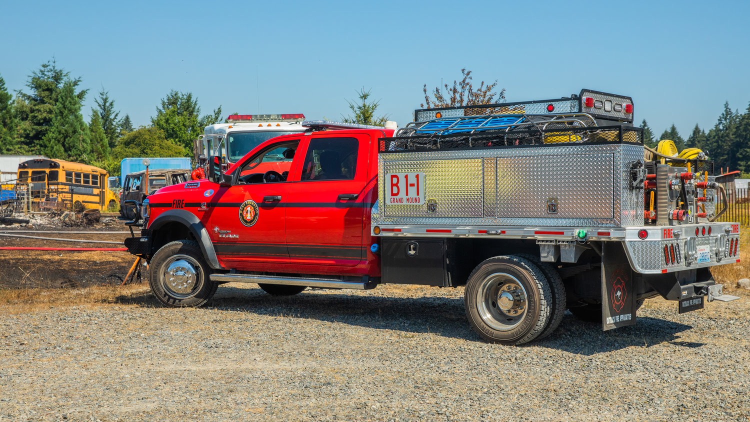 A West Thurston Fire truck is seen parked alongside scorched grass in Rochester on Sunday following a fire.