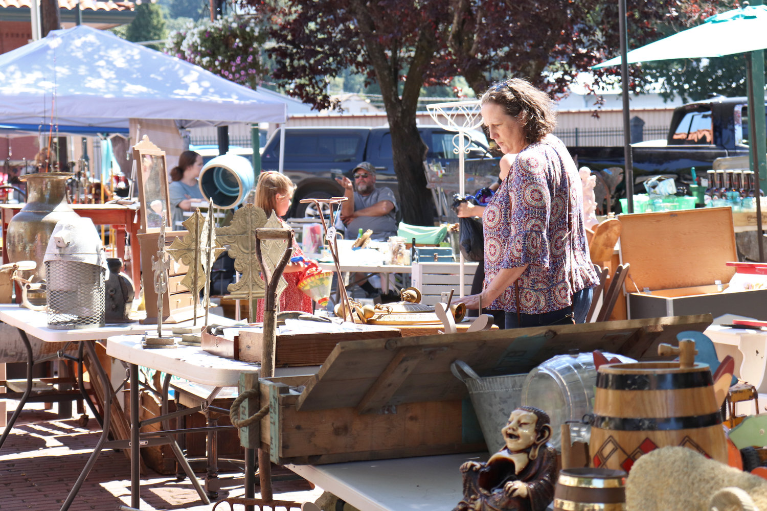 Customers browse the Antique Fest flea market in downtown Centralia on Sunday.