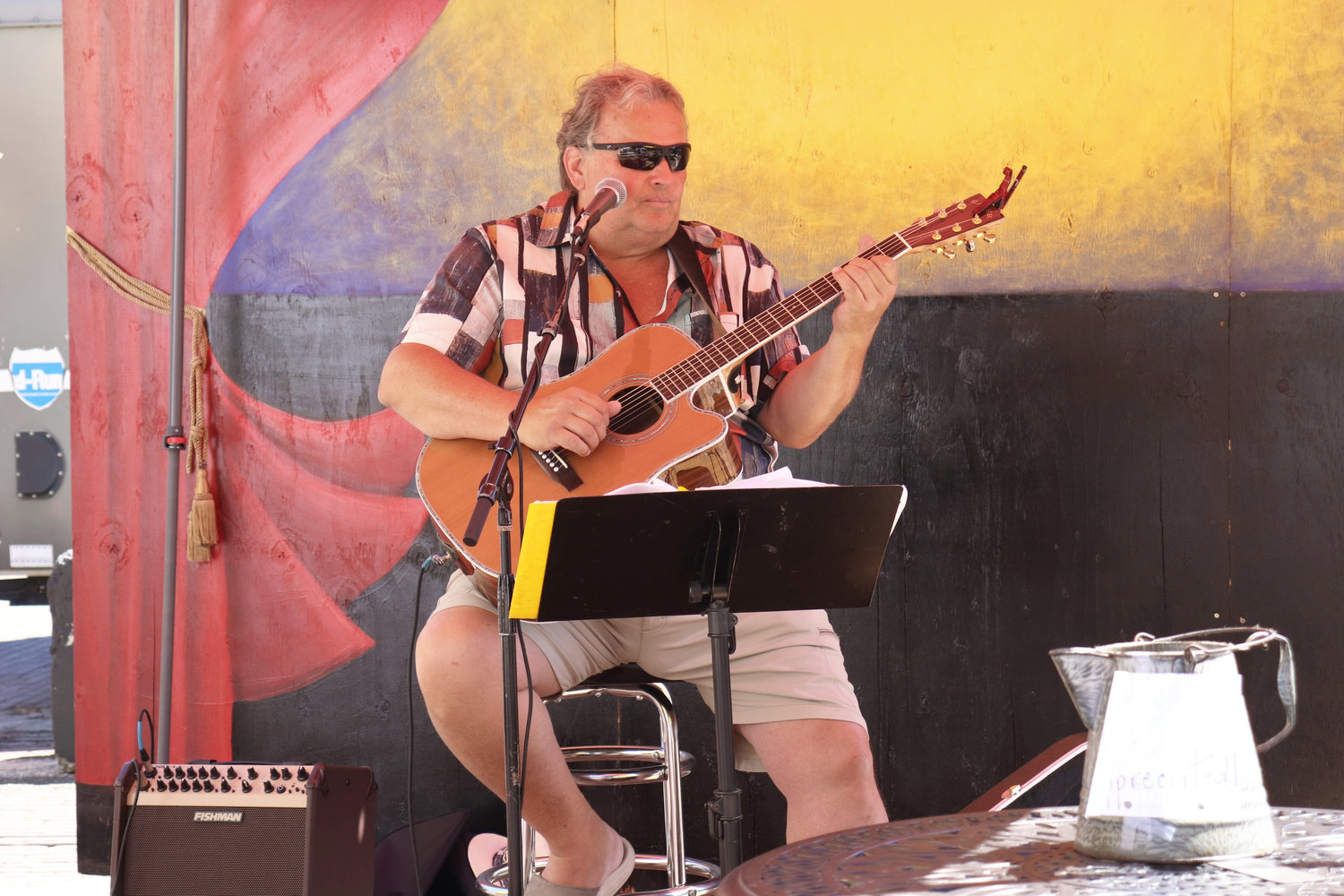 Musician Dennis Harris performs at Antique Fest in downtown Centralia on Sunday.