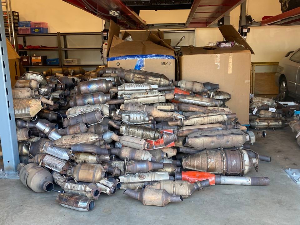 About 1,000 stolen catalytic converters sit in a Beaverton Police Department garage after being taken for evidence in a months-long investigation into a local organized crime ring.