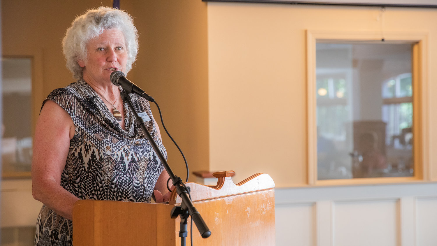 Maureen Harkcom, a board member on the Lewis County Farm Bureau, describes challenges farmers face with water rights during a chamber forum in Centralia on Thursday.
