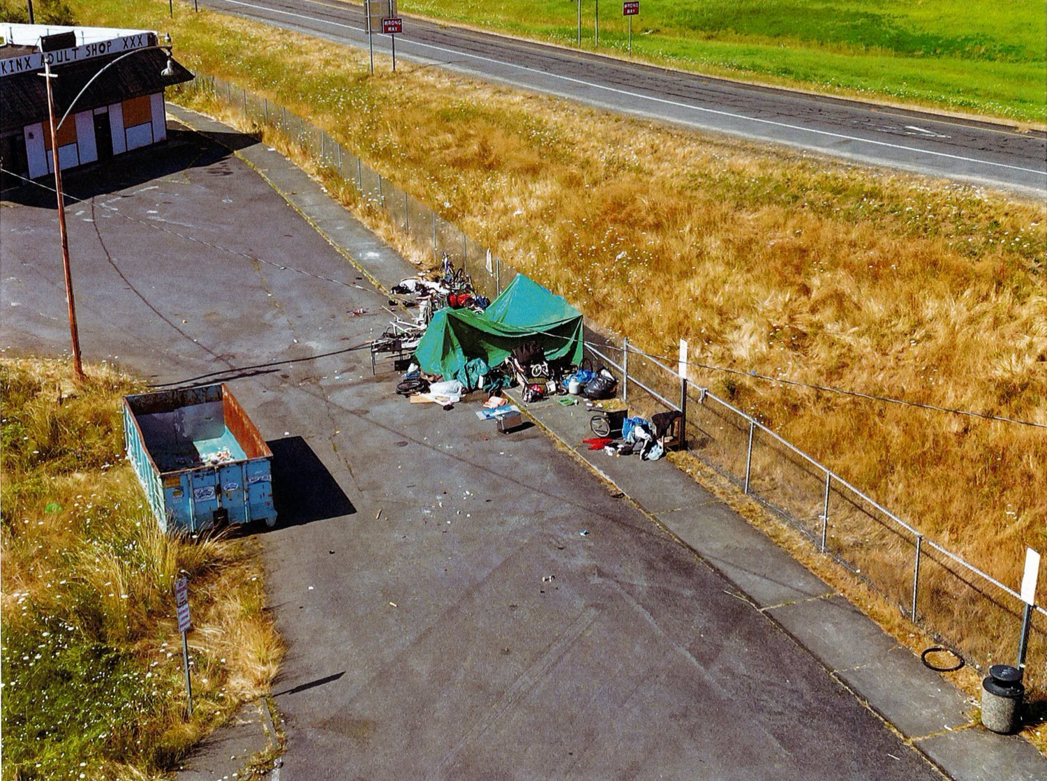 FILE PHOTO — A homeless encampment that was located on private property near the park and ride on Main Street in Chehalis, next to Interstate 5 Exit 77, was cleaned up last year.