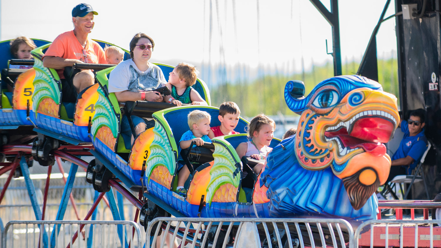 A rollercoaster takes passengers on a ride at the Southwest Washington Fairgrounds Tuesday evening in Centralia.