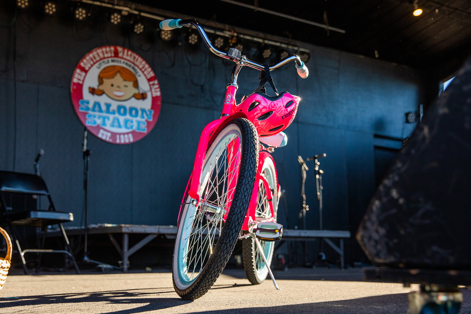 A bike presented by the Silver Agency is awarded to the new Little Miss Friendly Tuesday on the Saloon Stage at the Southwest Washington Fairgrounds.