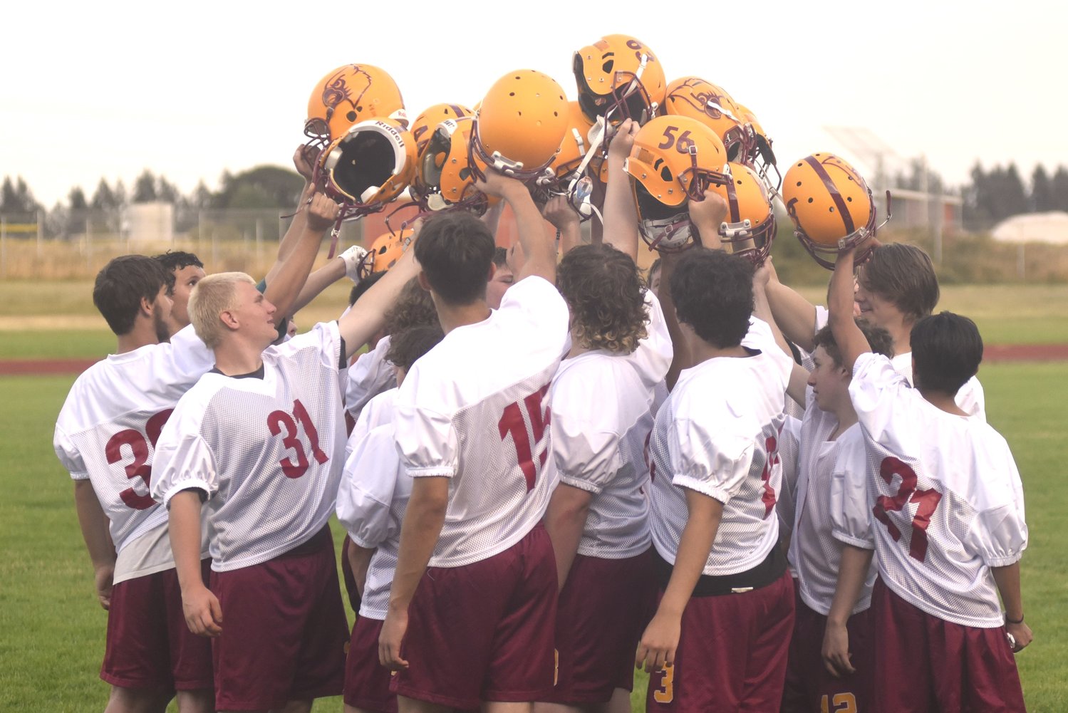The Winlock football team gets a break to end its first fall camp practice, on Aug. 17.