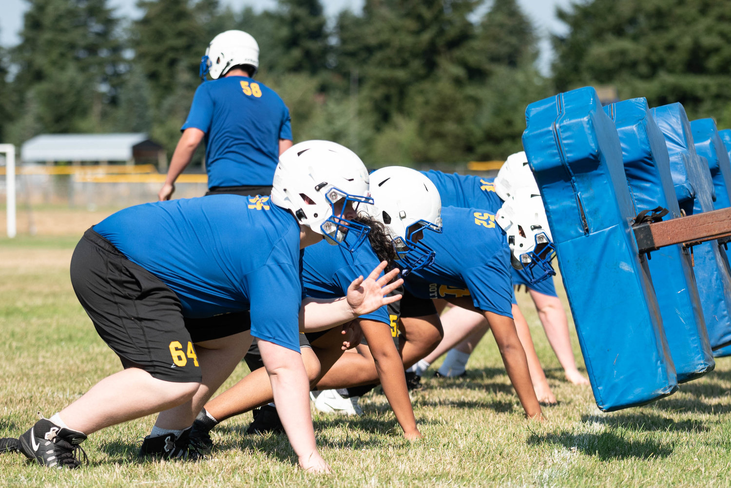 Rochester lineman line up before a drill Aug. 19.
