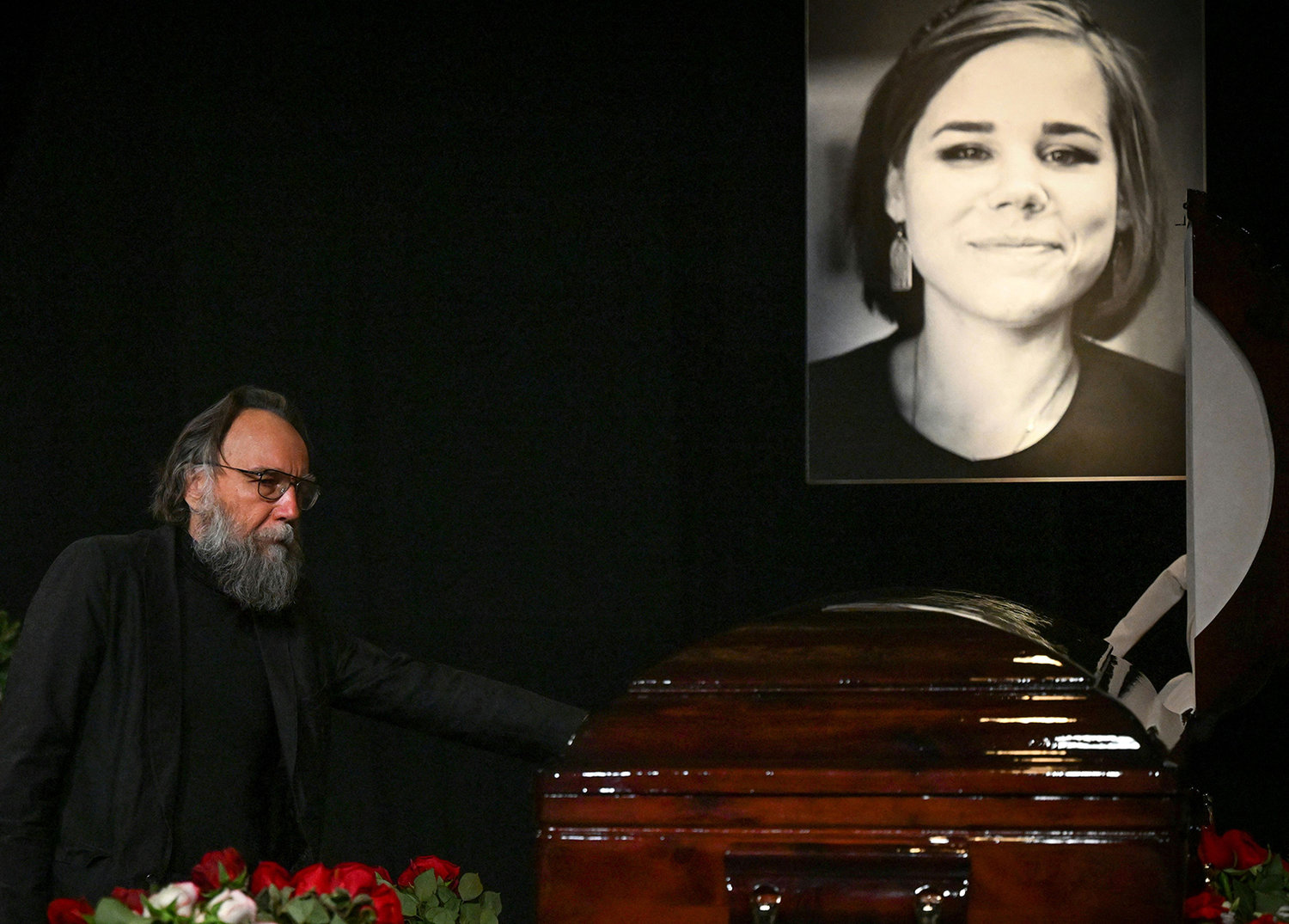 Russian ideologue Alexander Dugin attends a farewell ceremony of his daughter Daria Dugina, who was killed in a car bomb explosion the previous week, at the Ostankino TV centre in Moscow on Aug. 23, 2022. - Daria Dugina followed in her father's footsteps, becoming a well-known media personality who worked for pro-Kremlin television channels including Russia Today and Tsargrad. (Kirill Kudryavtsev/AFP via Getty Images/TNS)