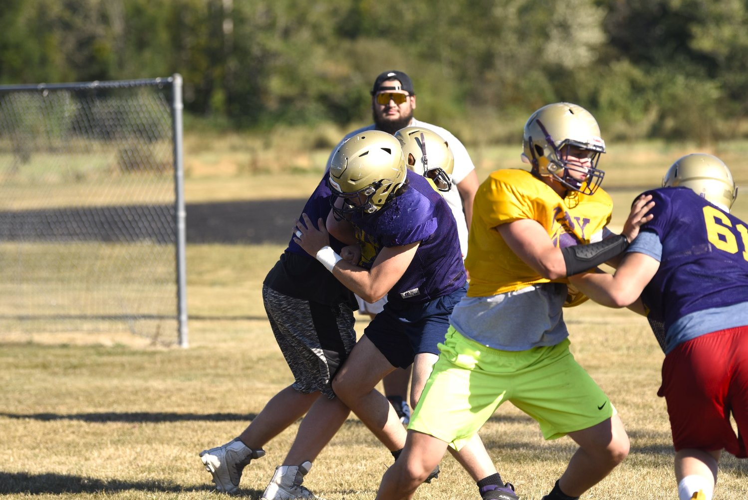 A group of Onalaska linemen run through a drill at practice on Aug. 23.