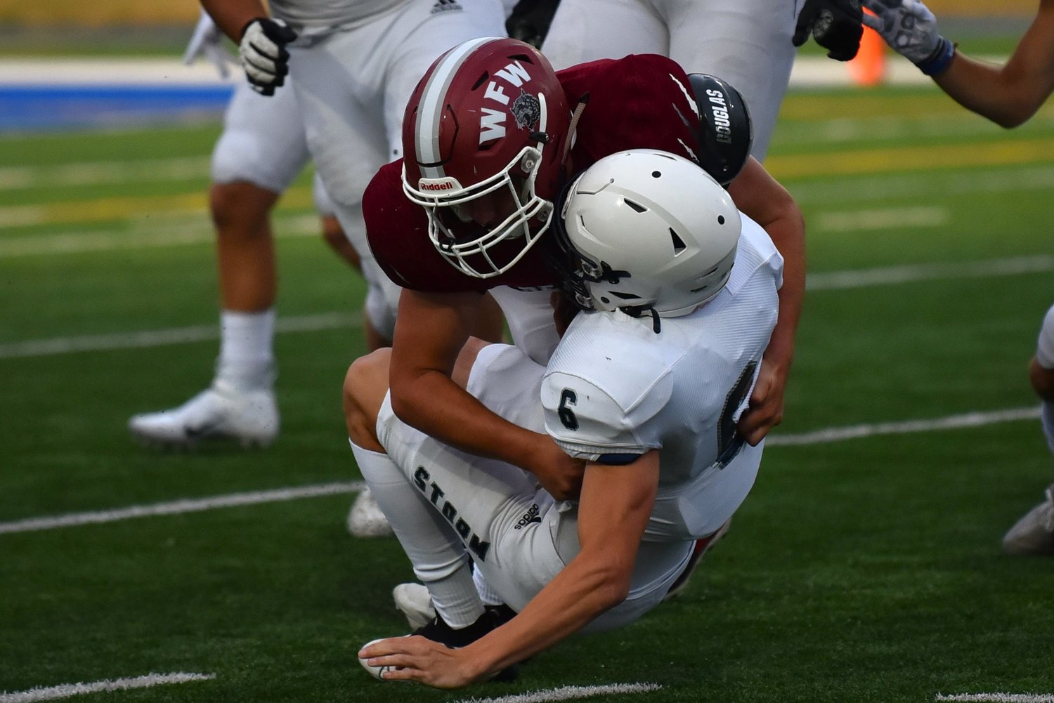 W.F. West's Andrew Penland takes down a Skyview ballcarrier in the backfield during a jamboree at Kelso's Schroeder Field on Aug. 26.
