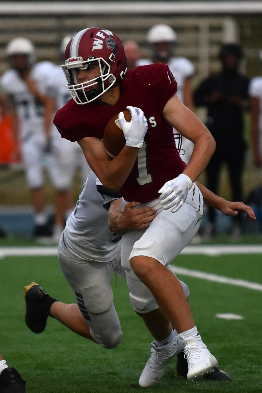 Tucker Land carries the ball against Skyview during a jamboree at Kelso on Aug. 26.