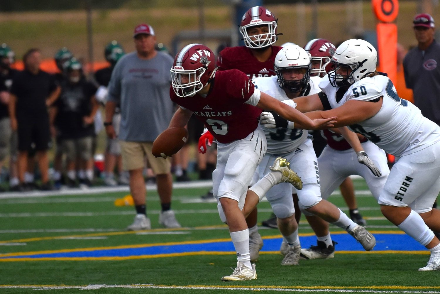 W.F. West quarterback Gavin Fugate breaks away from a would-be tackler during the Bearcats' offensive set against 4A Skyview, at a jamboree at Kelso High School on Aug. 26.