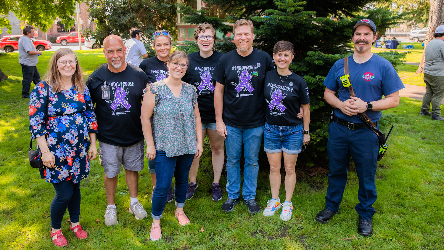 Providers and attendees smile for a photo at George Washington Park in Centralia during an overdose awareness event on Wednesday.