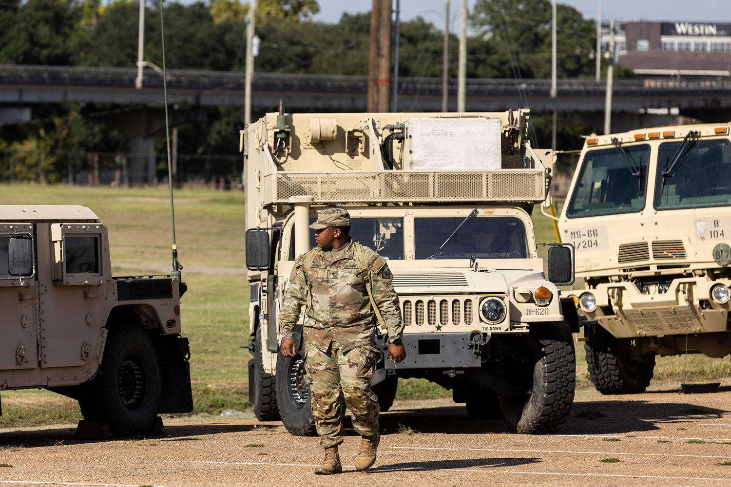 Personnel and equipment from the Mississippi National Guard organize inside of the Mississippi State Fairgrounds in response to the water crisis on Sept. 1, 2022, in Jackson, Mississippi. Jackson has been experiencing days without reliable water service after river flooding caused the main treatment facility to fail. (Brad Vest/Getty Images/TNS)