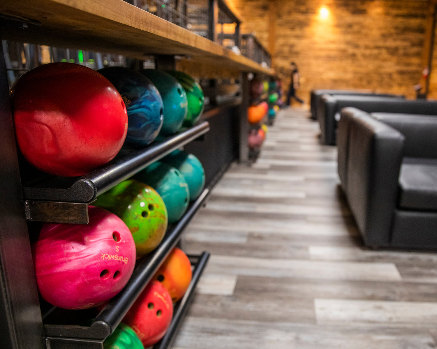 Bowling balls fill shelves at the Mill Town Smokehouse in Morton.