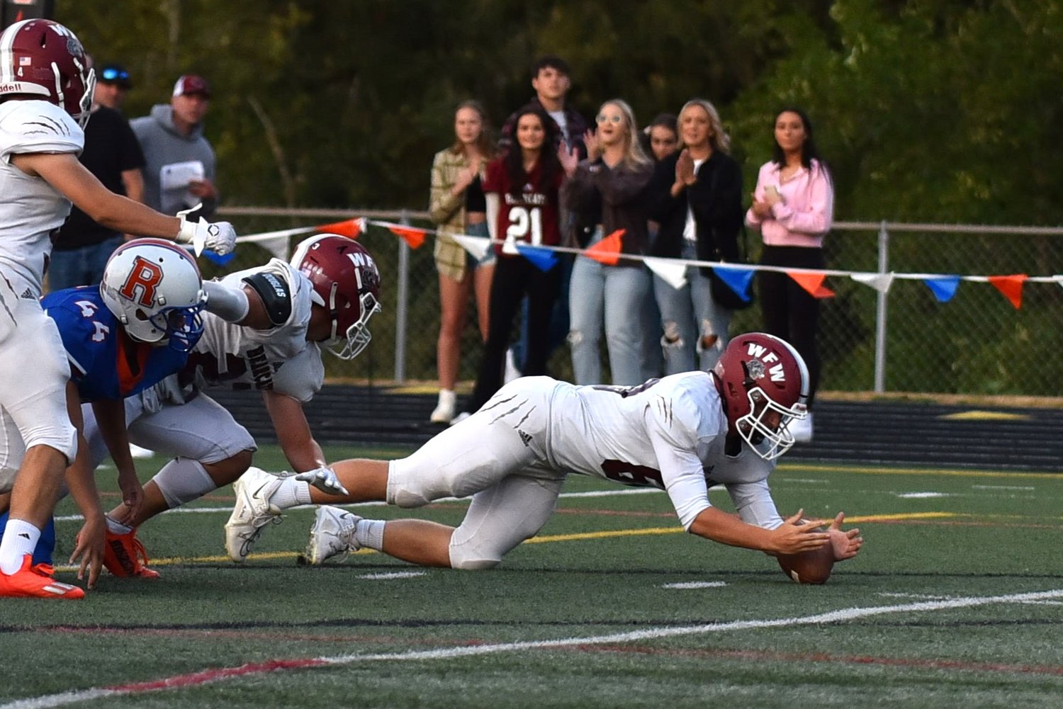 Hunter Niemi dives on a fumbled kickoff to give WFW possession right back in the first quarter of the Bearcats' 38-28 win at Ridgefield on Sept. 3.