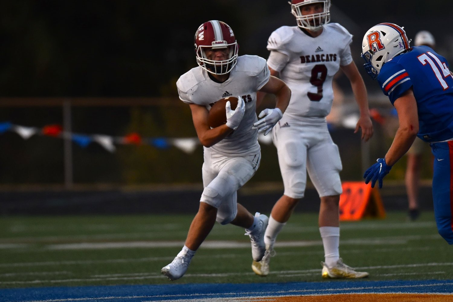 Tucker Land carries the ball in the first half of W.F. West's 38-28 win over Ridgefield, on Sept. 3.