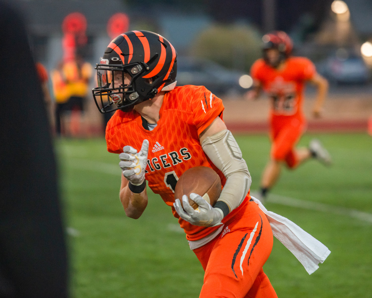 Centralia Tigers running back JoJo Simpson takes the ball up the field after a successful catch against Battle Ground in a home game Friday night.
