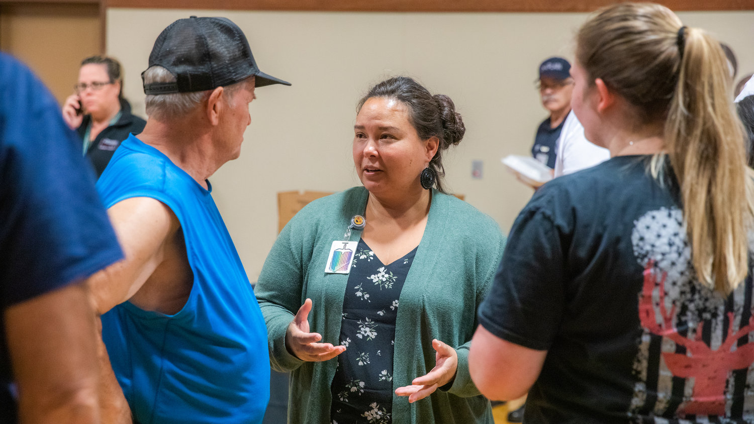 Director of Lewis County Public Health & Social Services Meja Handlen talks with residents ready to return home after evacuation orders were downgraded from the Goat Rocks Fire.
