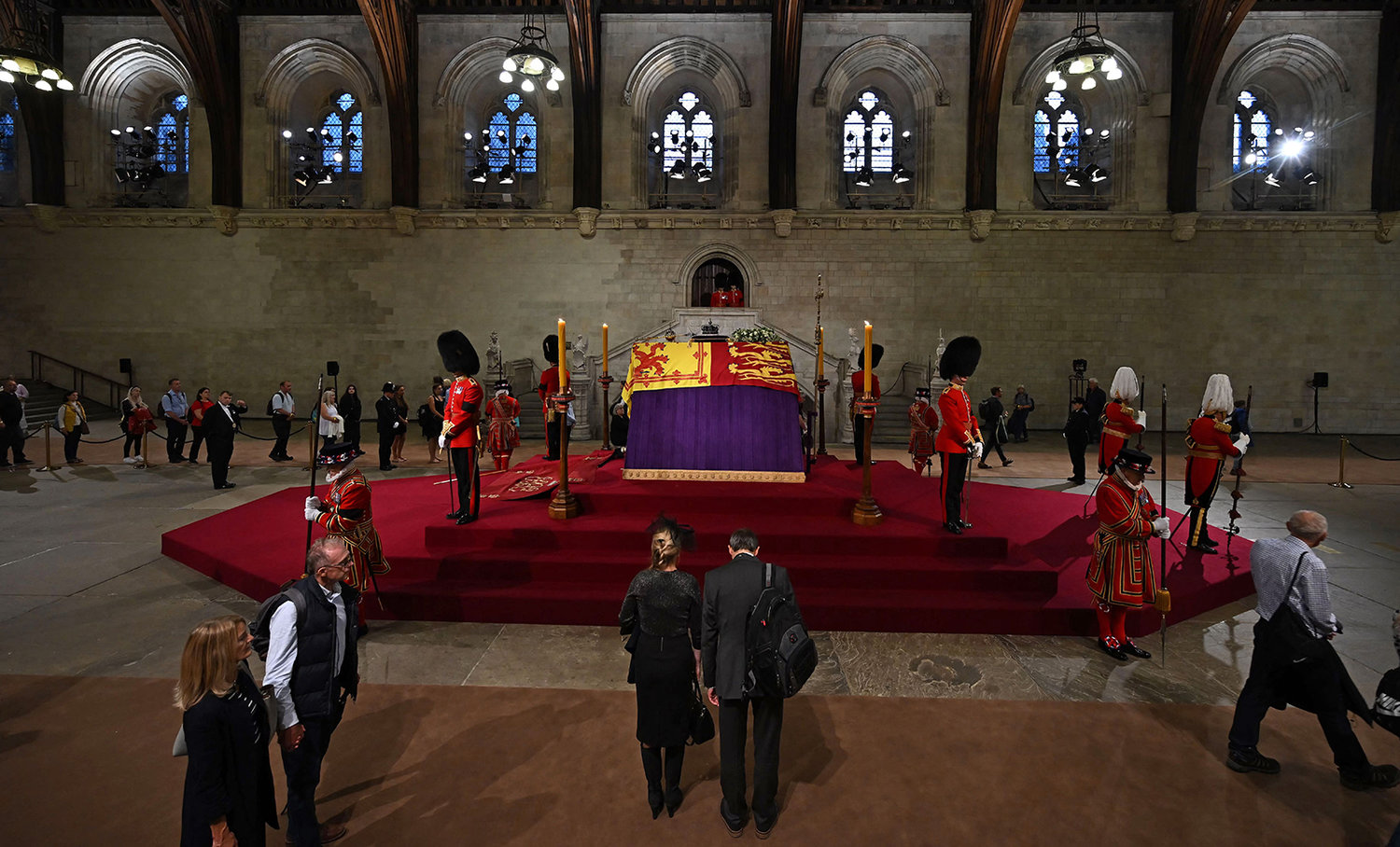 Members of the public file past the coffin of Queen Elizabeth II, inside Westminster Hall, at the Palace of Westminster, in London on Sept. 14, 2022, where it Lies in State on a Catafalque. (Ben Stansall/Pool/AFP via Getty Images/TNS)