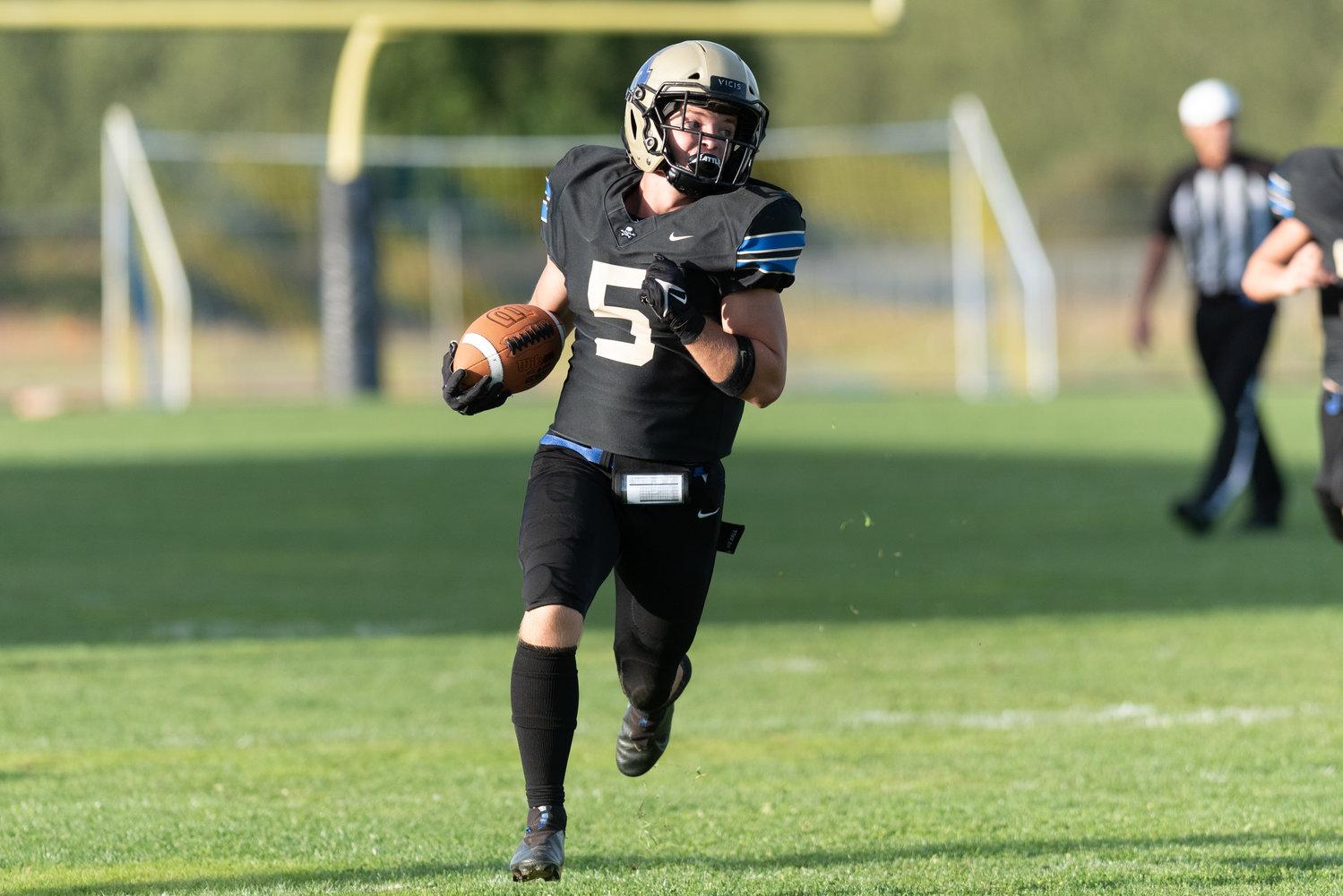 Jaxon Gunnagan carries the ball downfield in Adna's 56-6 win over White Swan on Sept. 16.