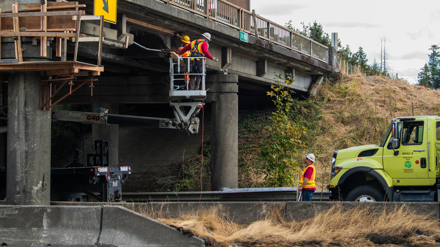 WSDOT crews inspect damage on the state Route 506 overpass to Interstate 5 after it was struck by northbound traffic on Thursday.