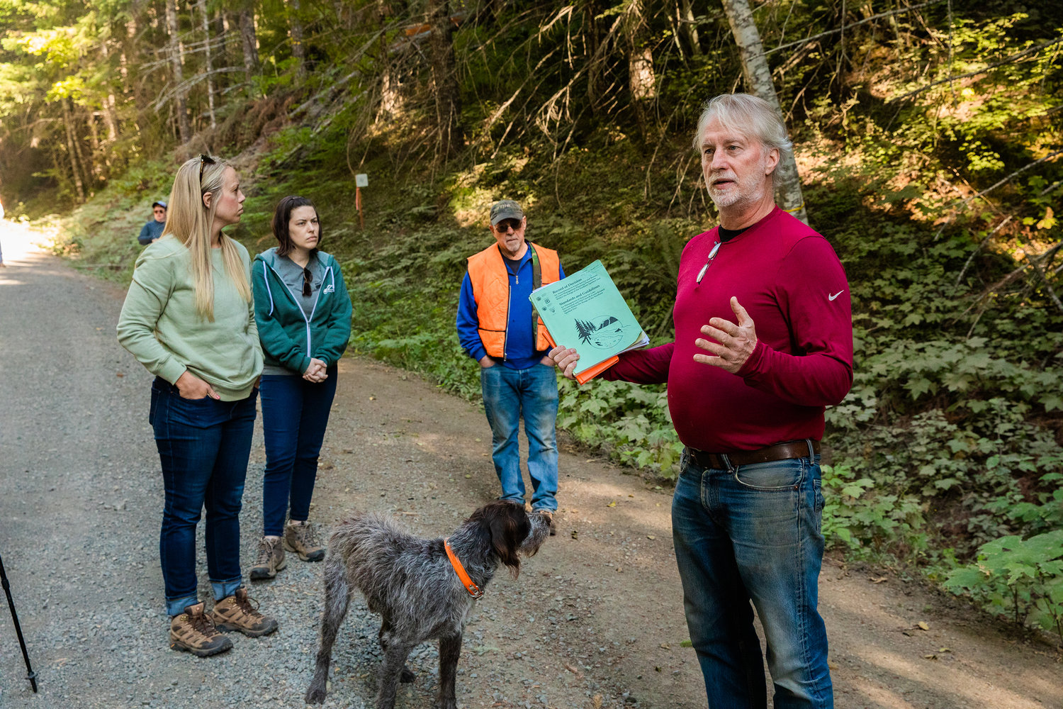 Ken Wieman, far right, a fish biologist with the U.S. Forest Service, talks about forest thinning and the importance of large woody debris.