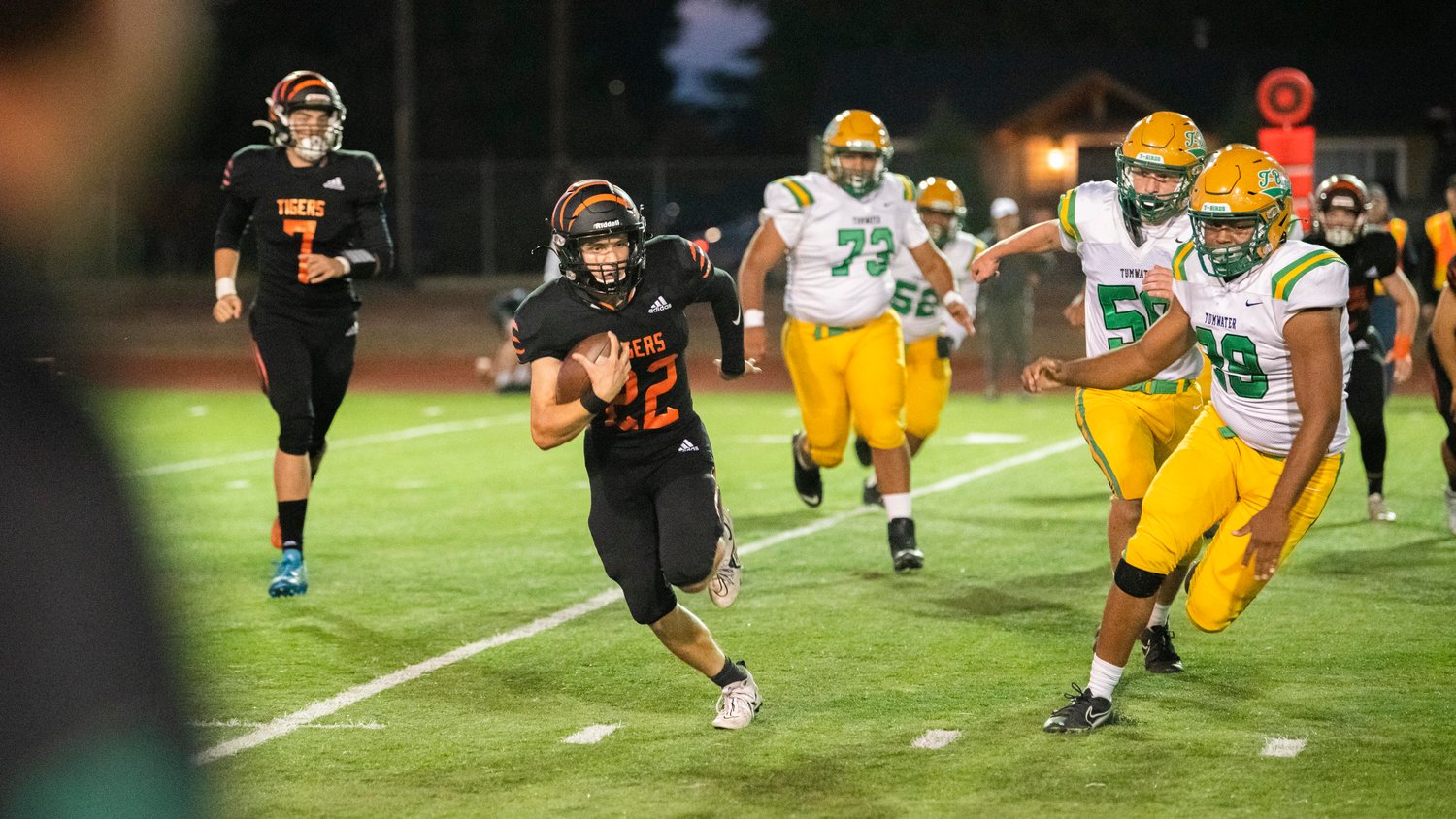 Centralia sophomore Kellen Rooklidge (22) runs with the football during a game against Tumwater Friday night.