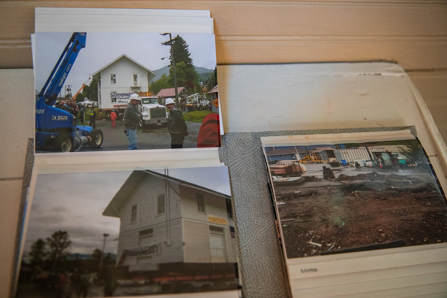 Photos from the 2005 moving process for the Depot Museum building sits on display Wednesday afternoon in Morton.