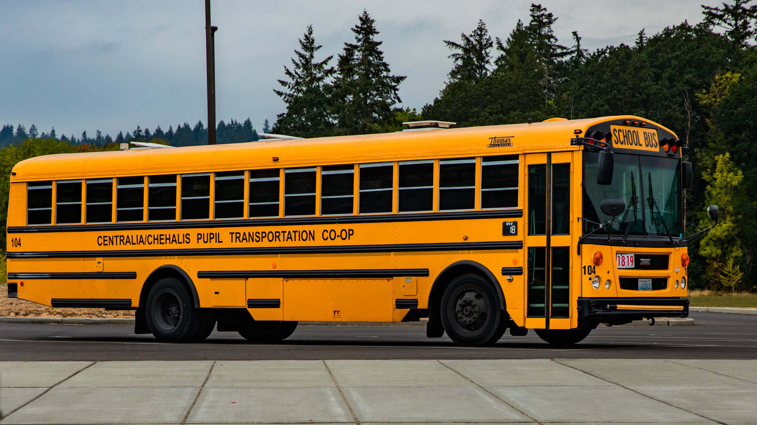 A Centralia-Chehalis Pupil Transportation Co-Op bus sits parked between James W. Lintott and Orin C. Smith Elementary Schools in Chehalis Wednesday morning.