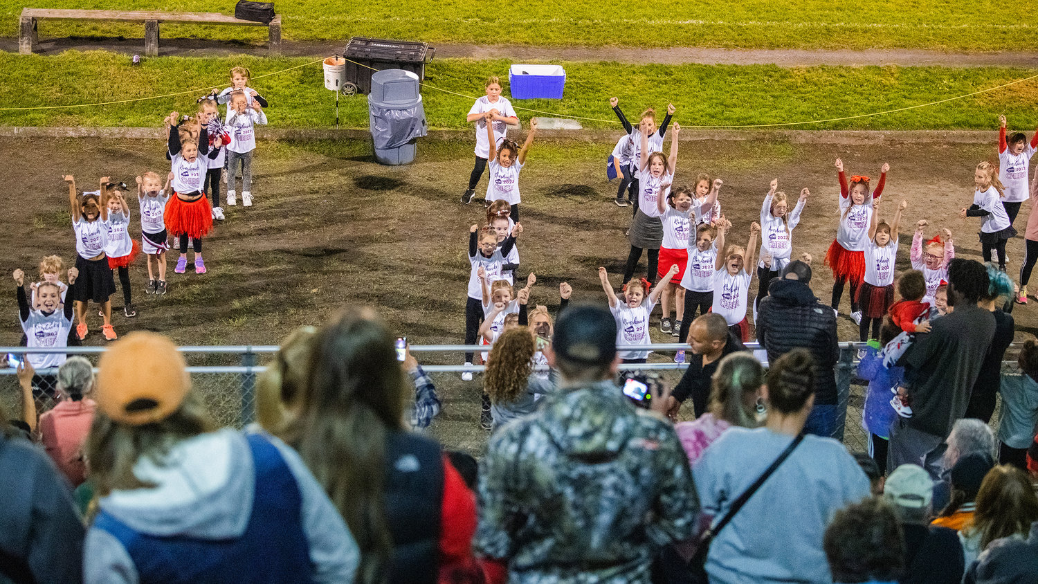 Kids cheer on the sidelines during halftime in Toledo.