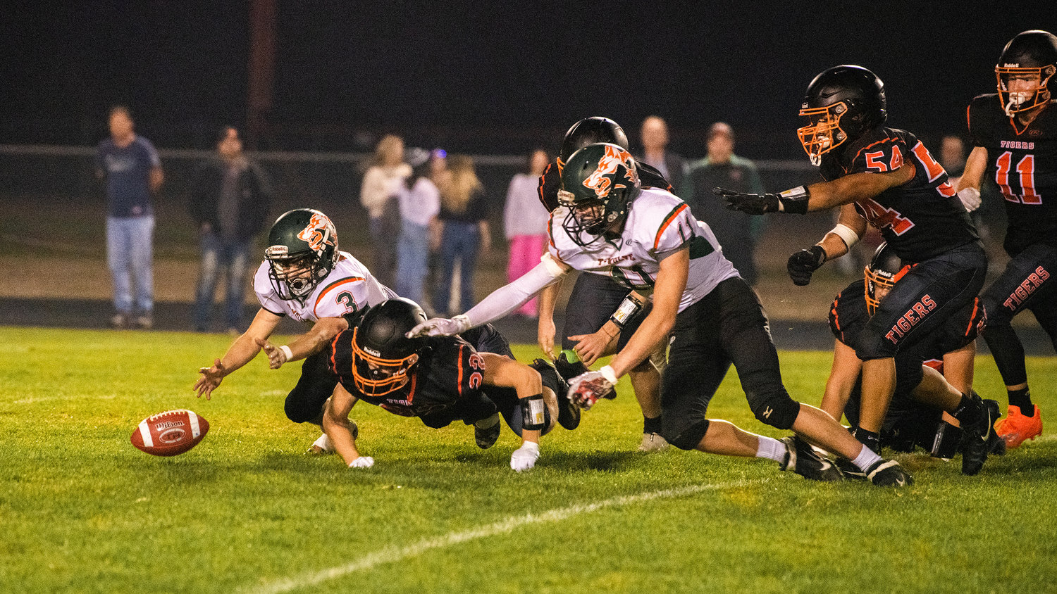 T-Wolves dive on a fumble during a Thursday night game in Napavine.