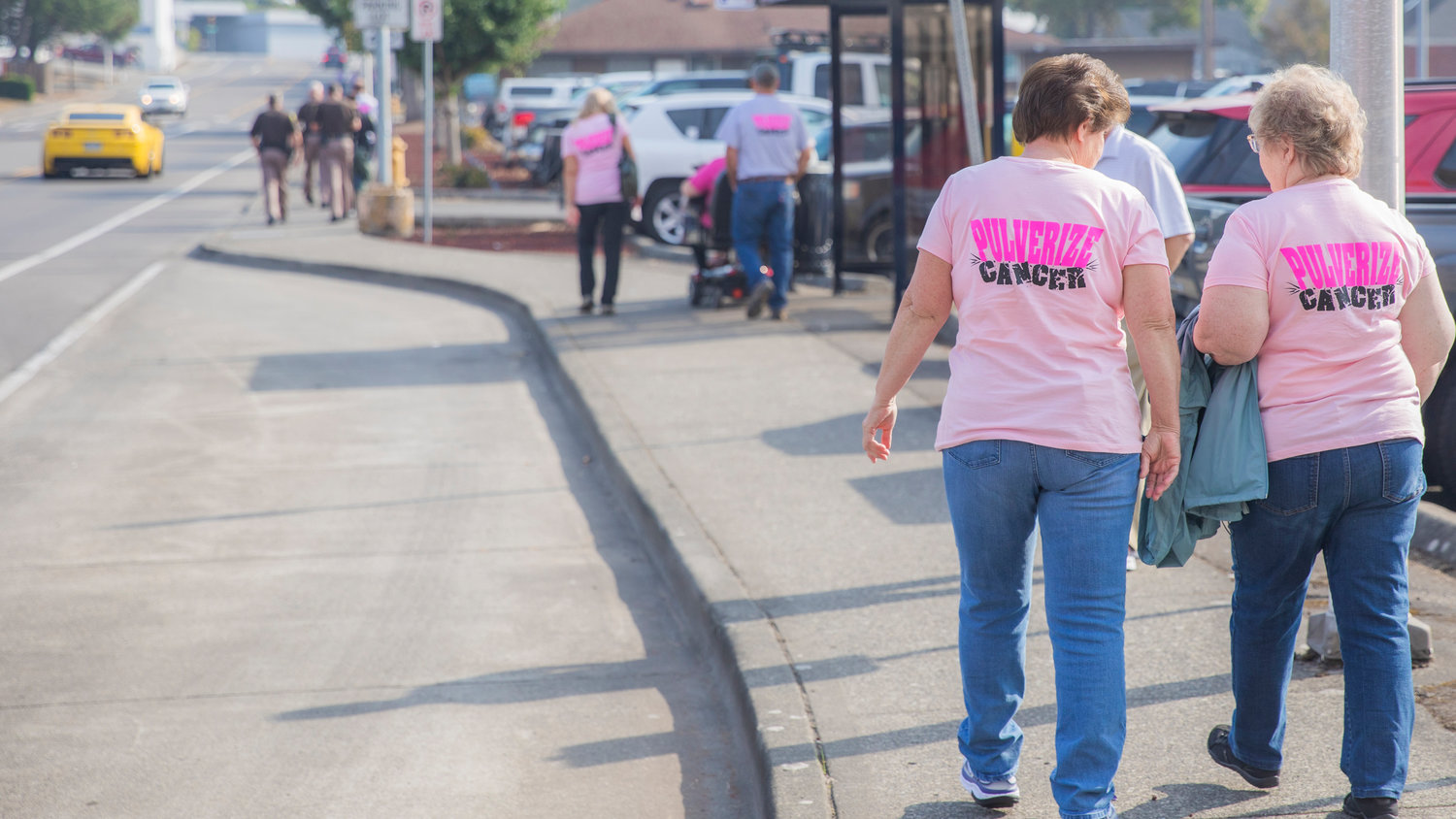 Participants sport “Pulverize Cancer,” shirts during a walk for Breast Cancer Awareness Month Friday morning in Chehalis.