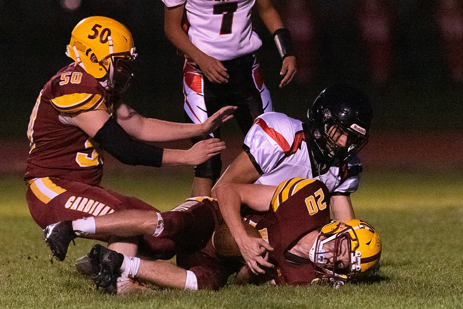 Kaiden Perkins jumps on a fumble during the first quarter of Winlock's 36-28 win over Oakville on Oct. 7.