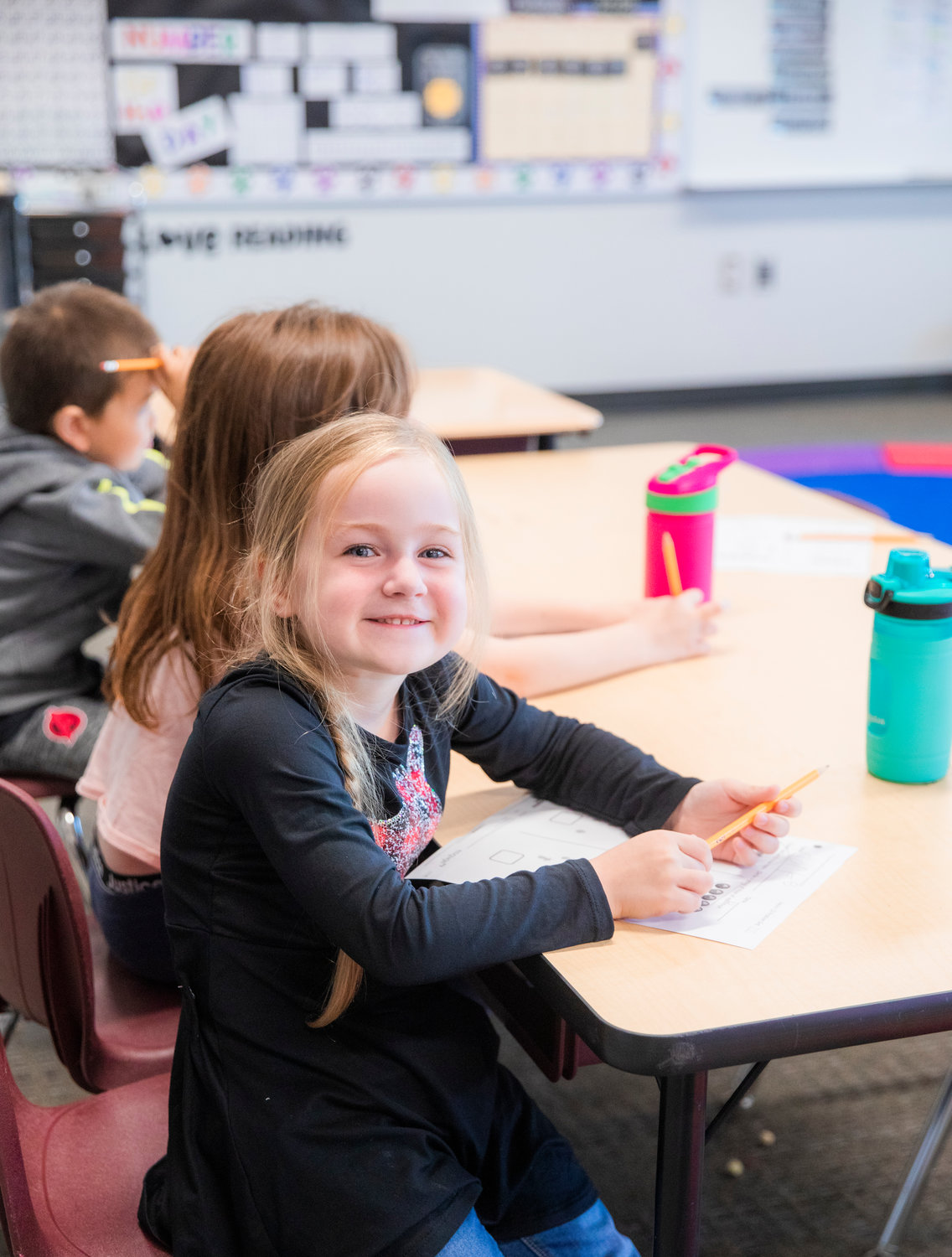 A student in Leslie Pagel’s first grade class smiles while attending class on Friday at James W. Lintott Elementary in Chehalis.