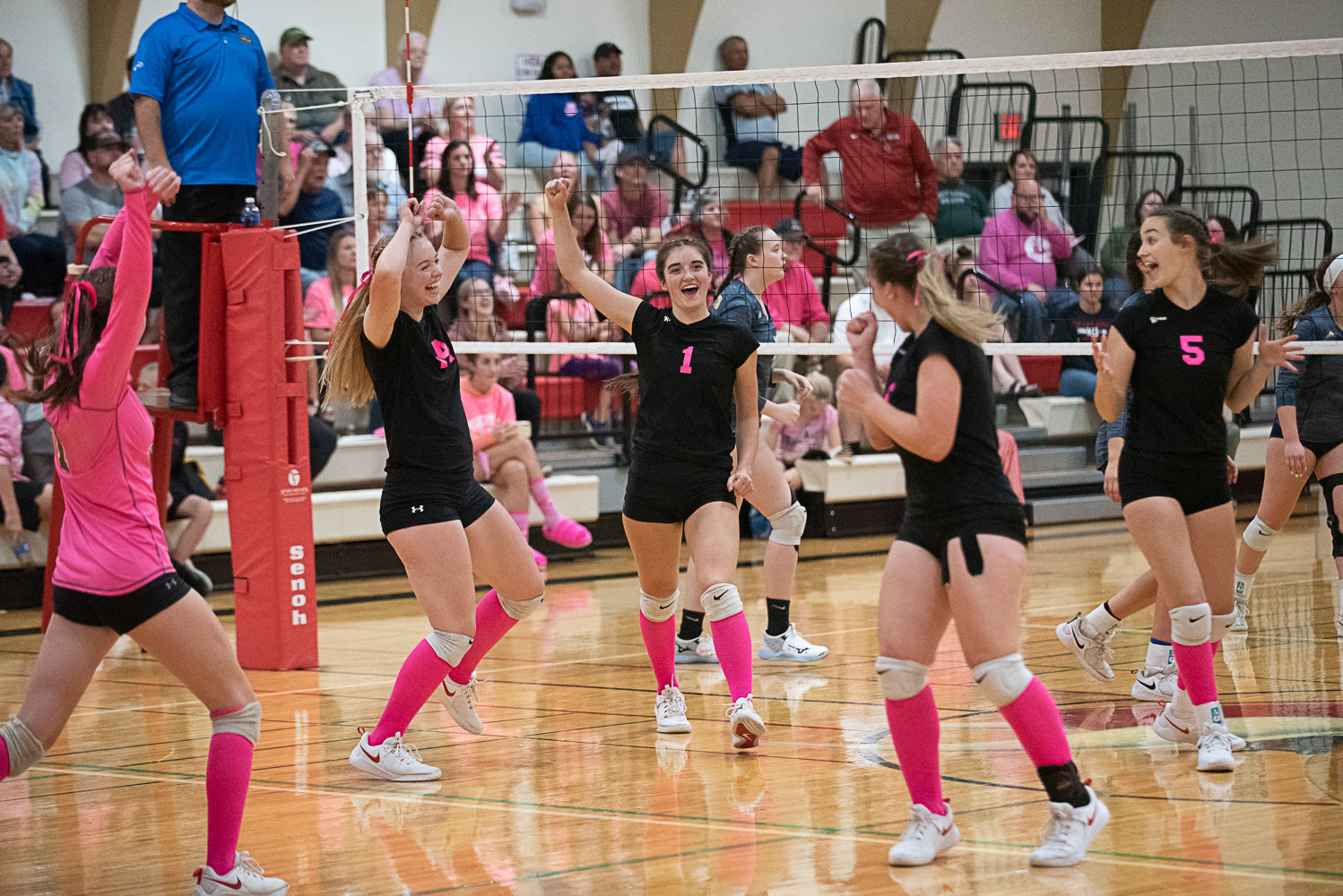 The Mossyrock volleyball team celebrates a point during its four-set win over Naselle on Oct. 13.