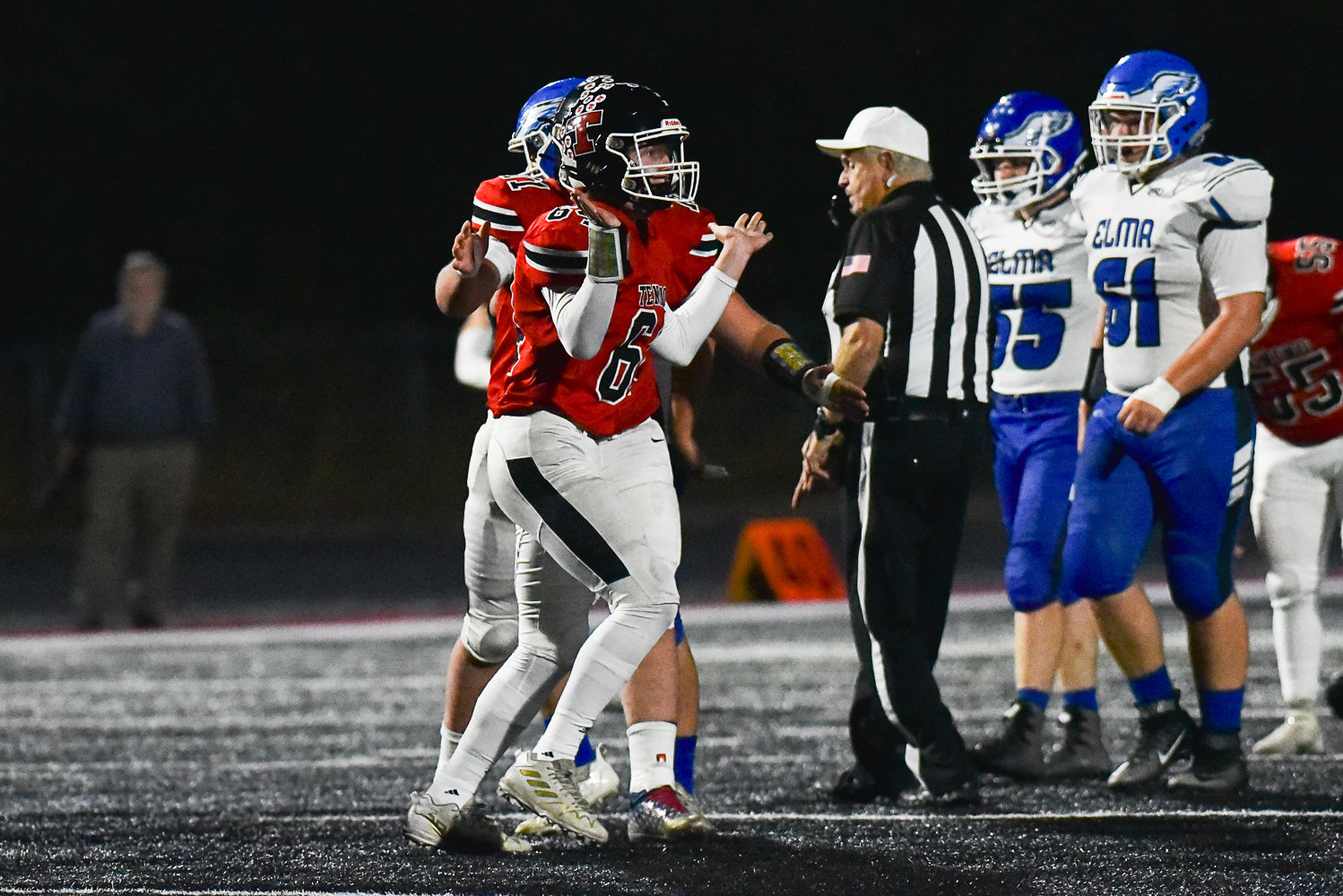 Mikey Vassar gives a little shrug to the sideline after a sack during Tenino's 66-26 win over Elma on Oct. 14.