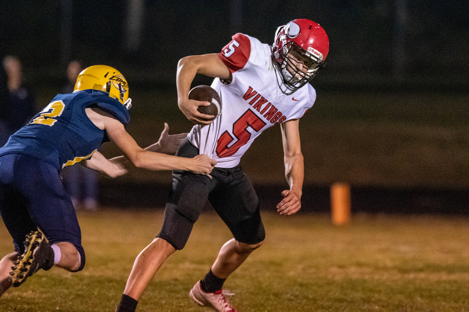 Mossyrock wideout Keegan Kolb (5) breaks a tackle before completing a 49-yard touchdown reception in the first quarter of a road game against Naselle on Oct. 14.