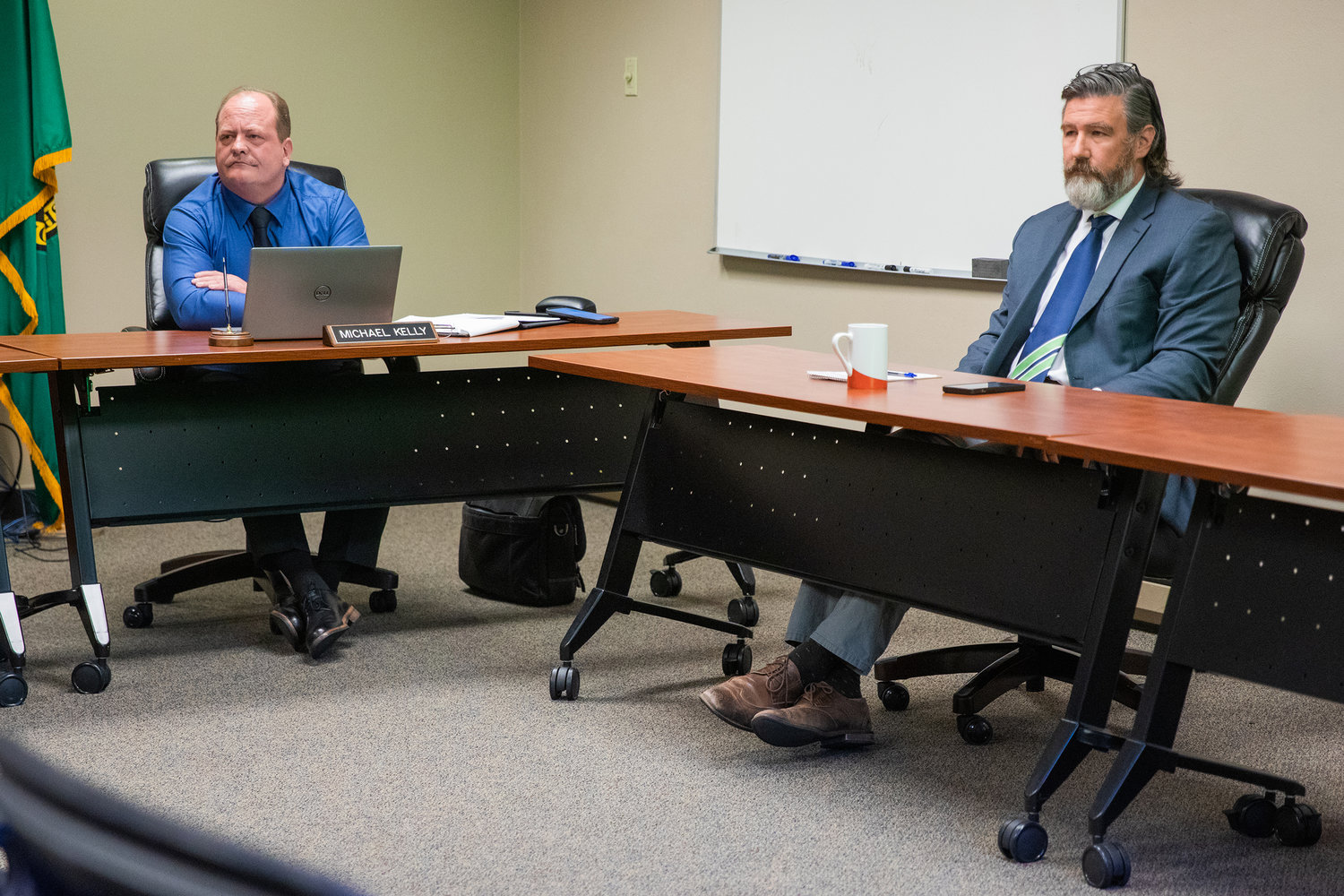 Commissioner Michael Kelly and General Manager Chris Rodin attend a Public Utility District meeting Tuesday morning in Chehalis.