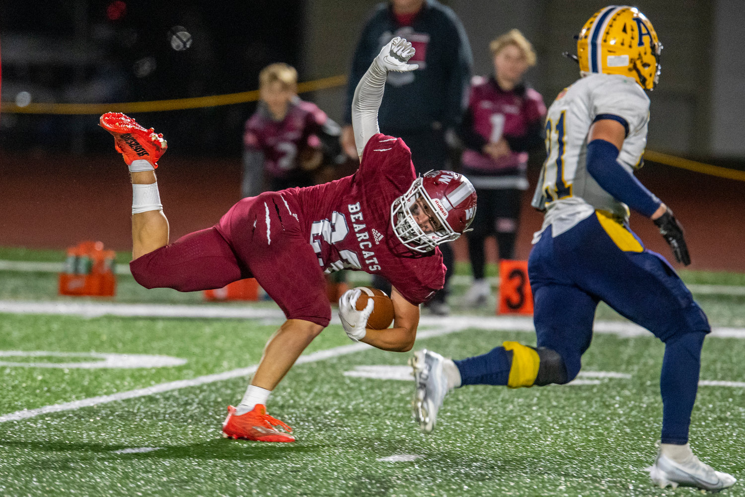 W.F. West's Evan Stajduhar (23) falls after hauling in a reception against Aberdeen at South Bend High School on Oct. 20.
