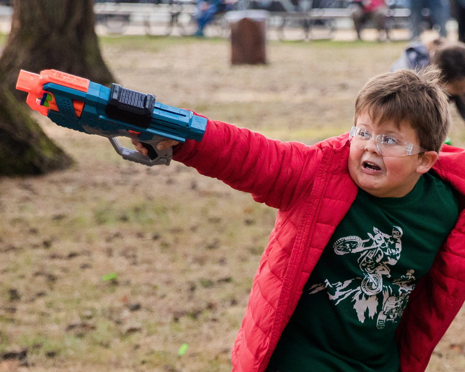 Kids react to incoming bullets during a Nerf War in honor of Titus Sickles and his Live Life List Fundraiser.
