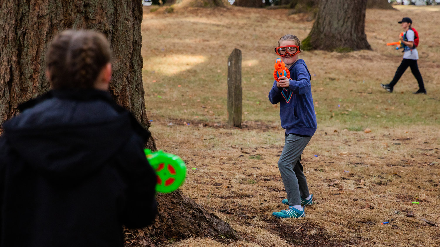 Eye protection is worn as visitors commence in a Nerf War at Borst Park in Centralia on Sunday.