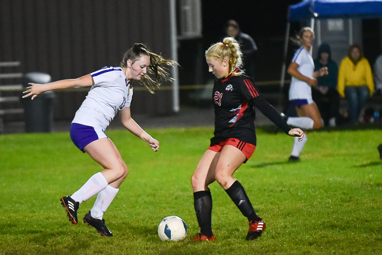 Onalaska's Randi Haight (left) and Toledo's Kailea Lairson (right) battle for possession during the first half of the Loggers' match against the Riverhawks on Oct. 24, in Toledo.