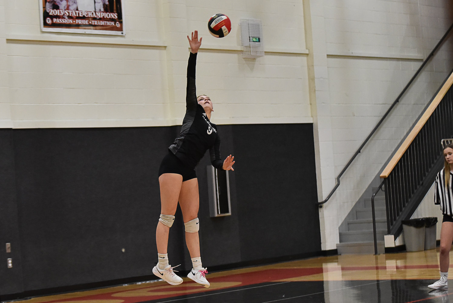 Napavine's Keira O'Neill serves up an ace during the Tigers' match at Toledo on Oct. 24.